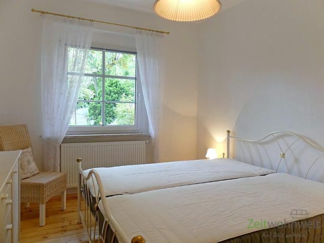 Schlafzimmer mit Gartenblick