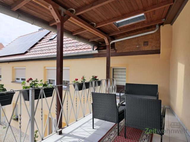 überdachter Balkon zum Innenhof