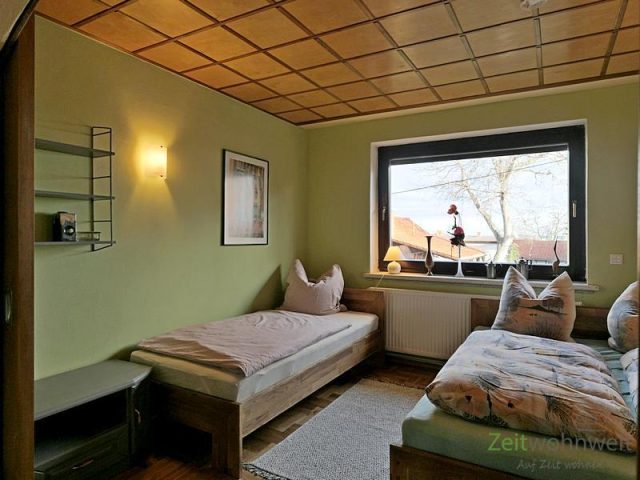 Extrabett im Schlafzimmer